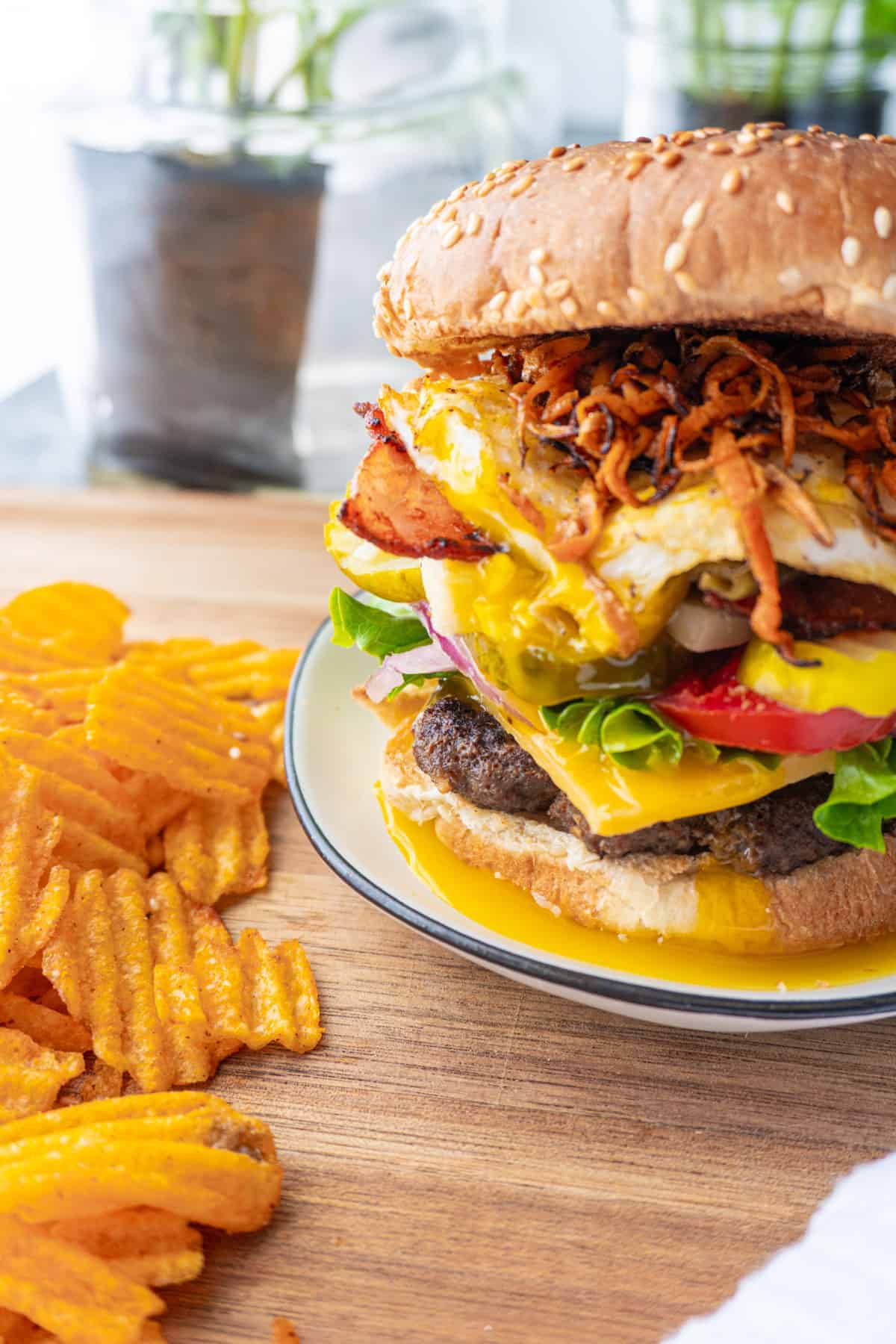 hamburger with fried egg and sweet potato strings