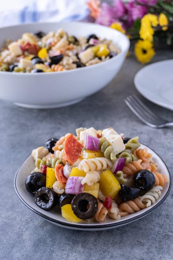 This easy pasta salad with pepperoni is quick and delicious! It’s great for dinner with the family or a party! #pastasalad #partyrecipe #bbq #atablefullofjoy #italianpastasalad #antipasta #sidedish #summer