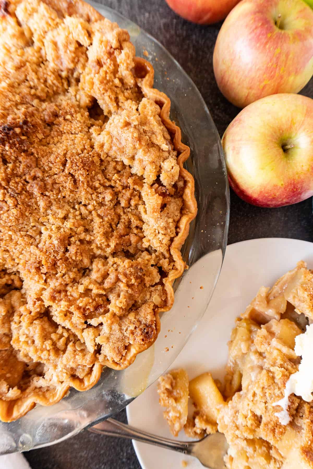 apple pie with a slice of pie next to it