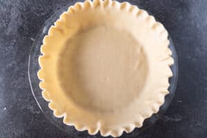 unbaked pie crust in pie dish