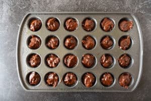 batter in muffin tin.