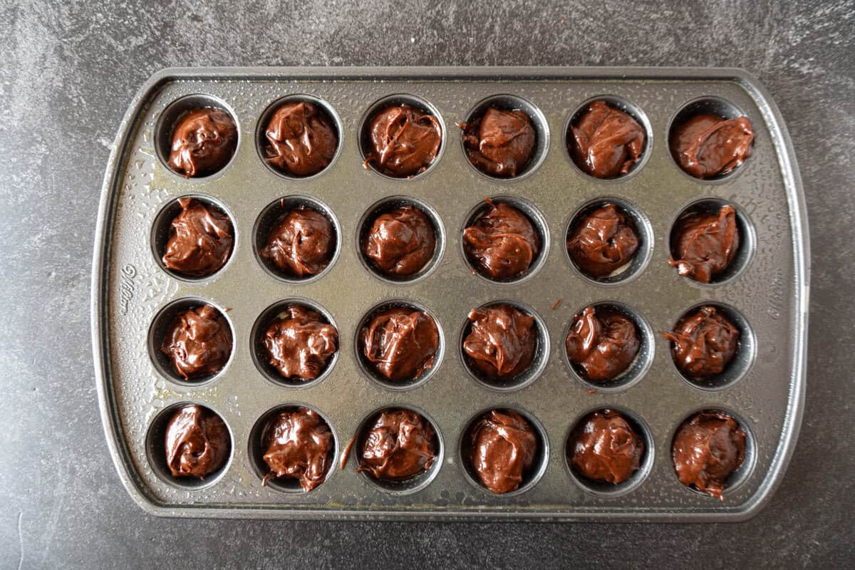 batter in muffin tin.