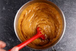 stirring in baking soda to caramel