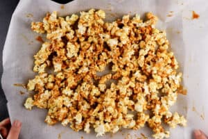 popcorn on baking sheet after stirring