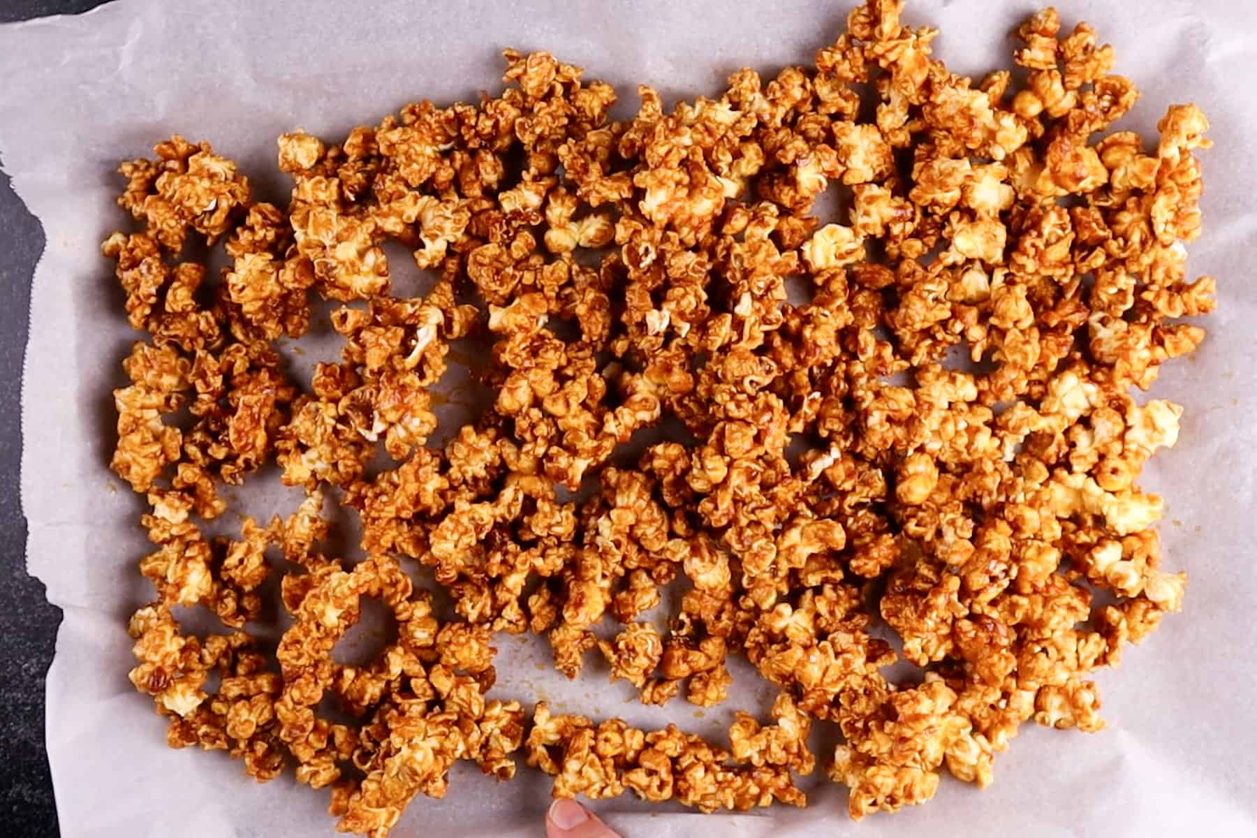 buffalo popcorn on baking sheet after baking