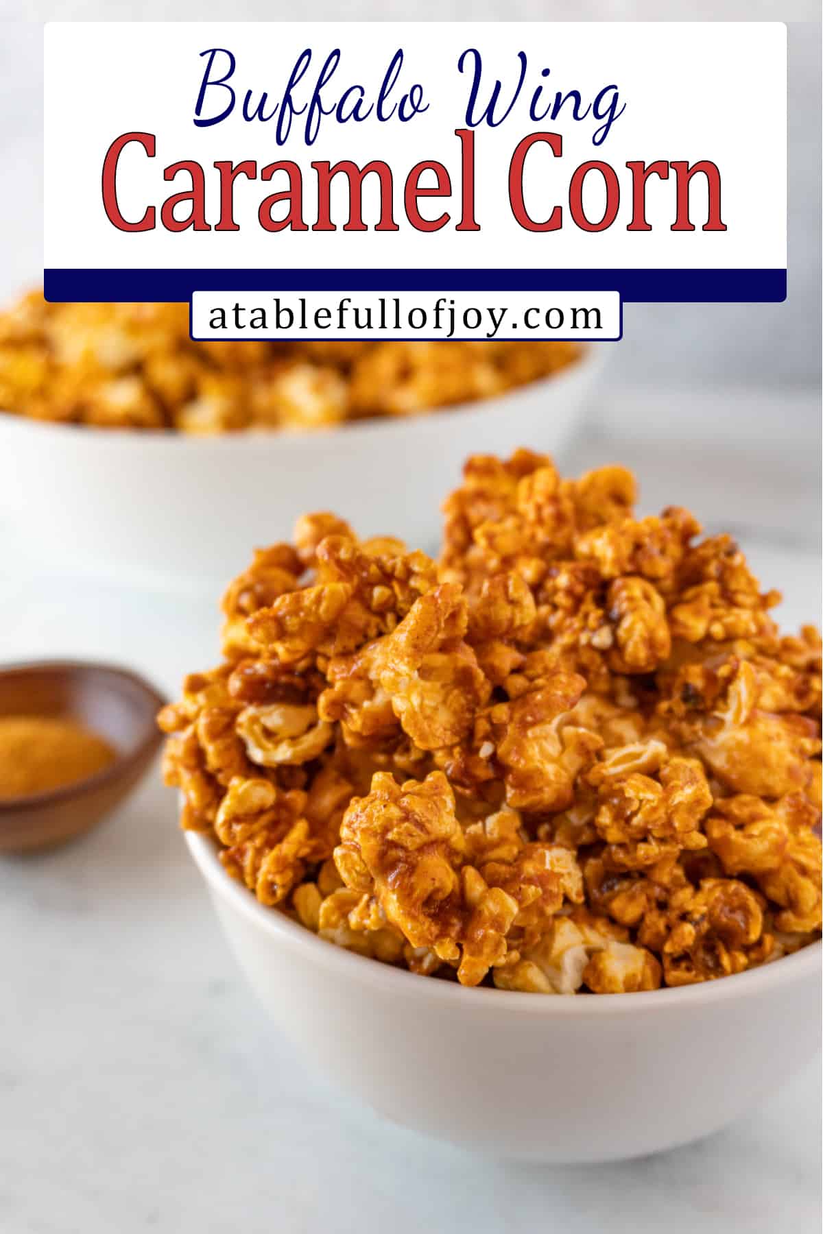buffalo popcorn in bowl with cayenne pepper in background pinterest image