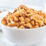 candied walnuts in white bowl featured image