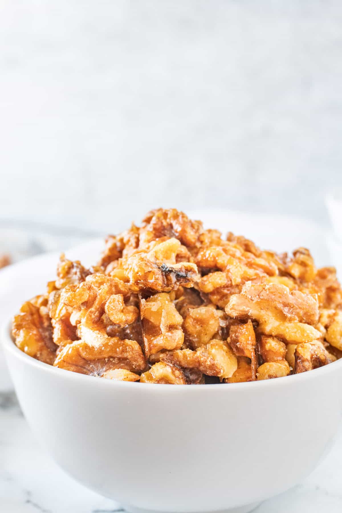 candied walnuts in white bowl