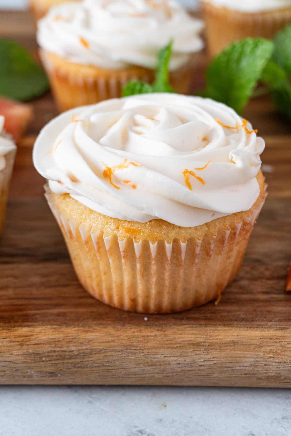grapefruit cupcakes close up on cutting board.