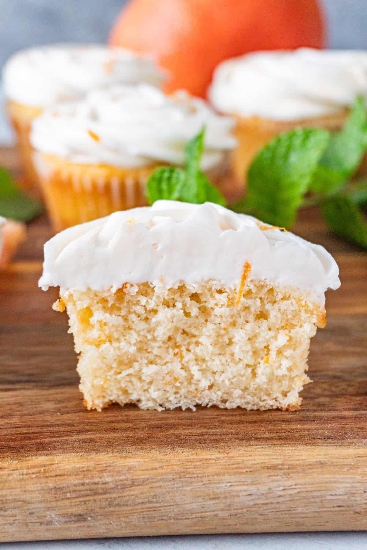 grapefruit cupcake cut in half.