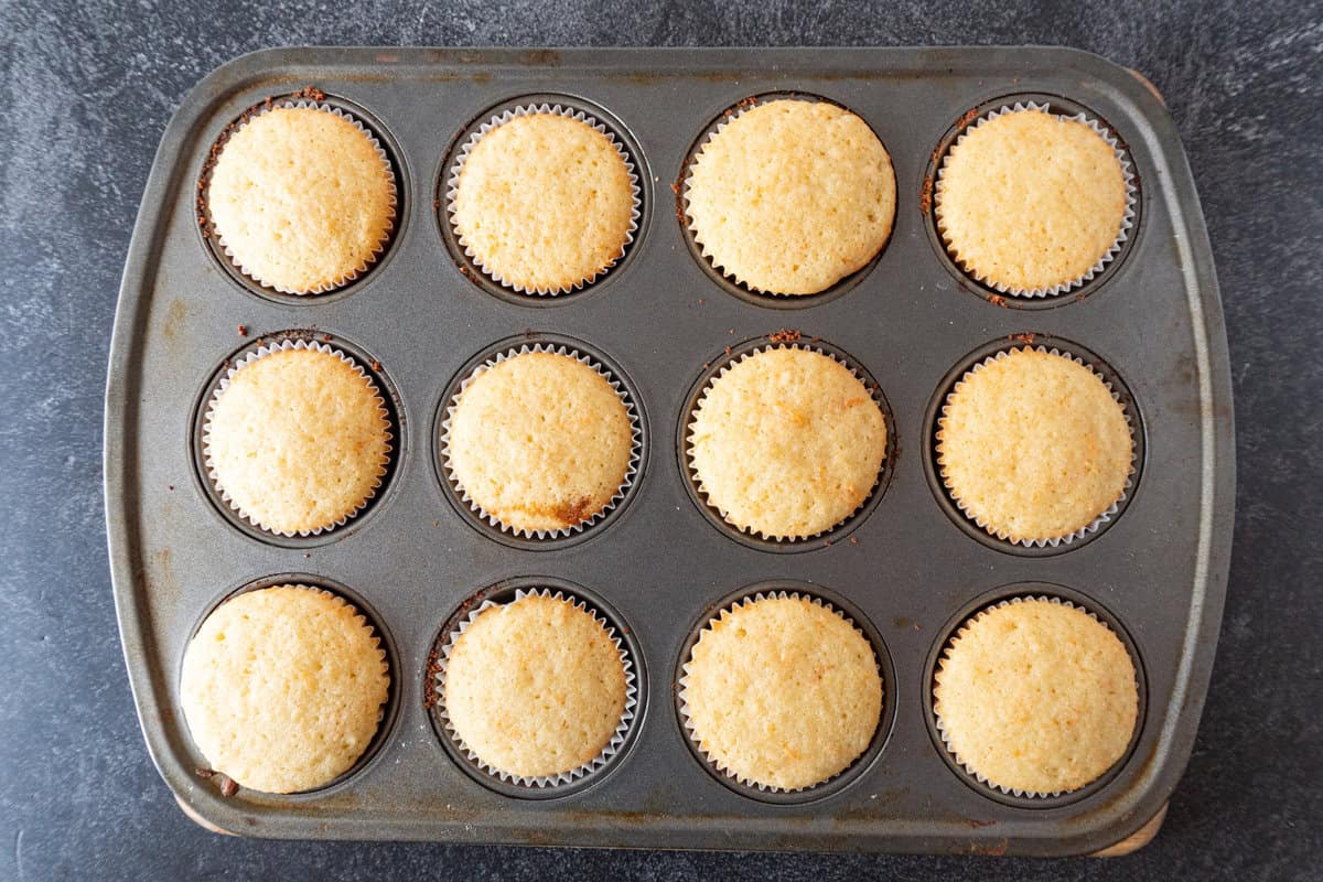 grapefruit cupcakes baked in pan.