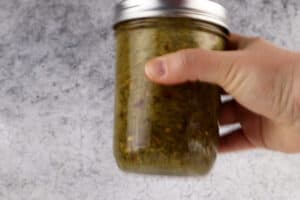 shaking dressing in a mason jar