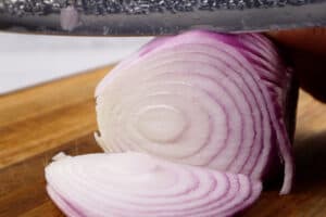 slicing a red onion