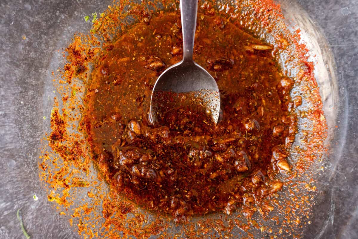 Steak Marinade in mixed together in clear glass bowl
