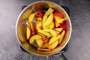 sliced peaches in sauce pan