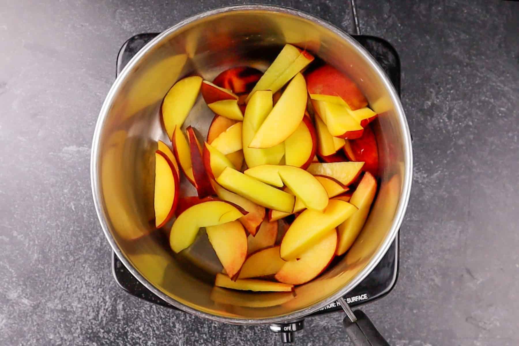 sliced peaches in sauce pan