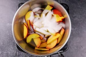 peaches and sugar in sauce pan before heating