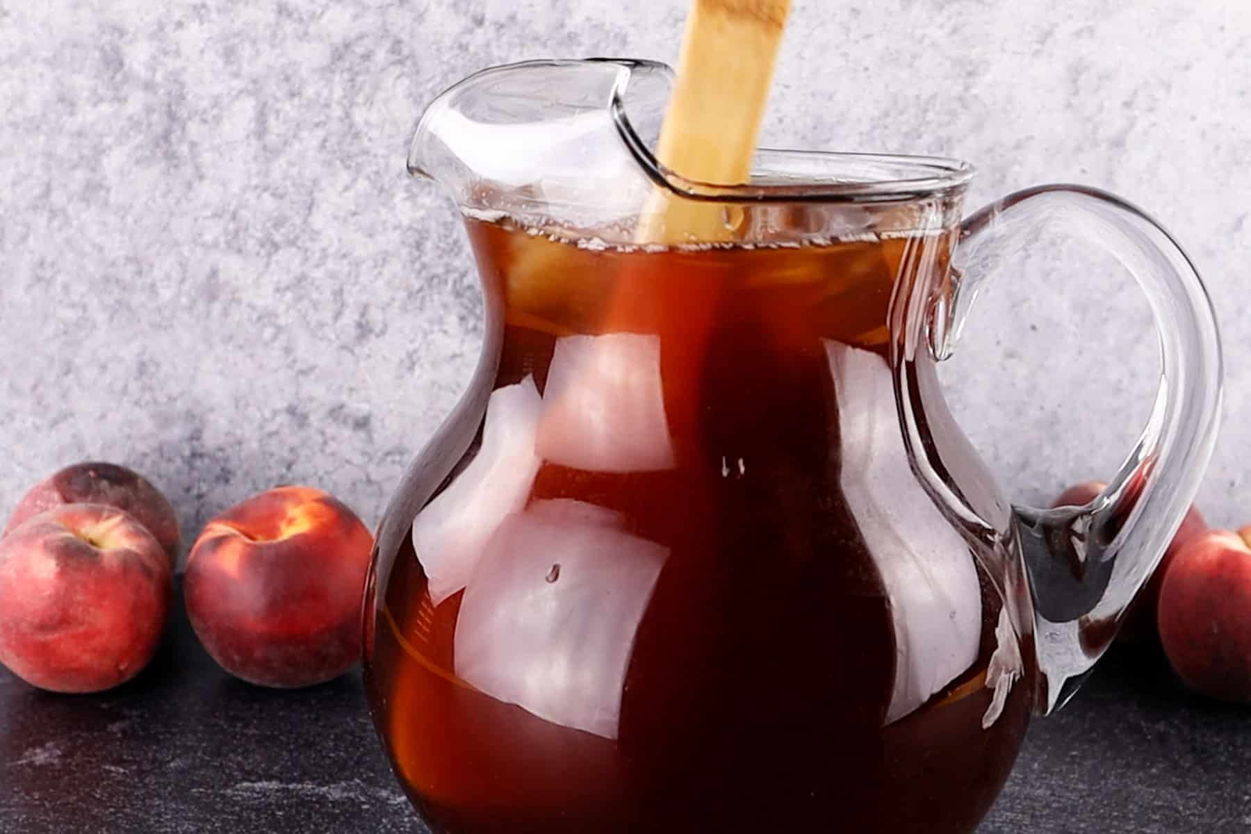 stirring tea in pitcher