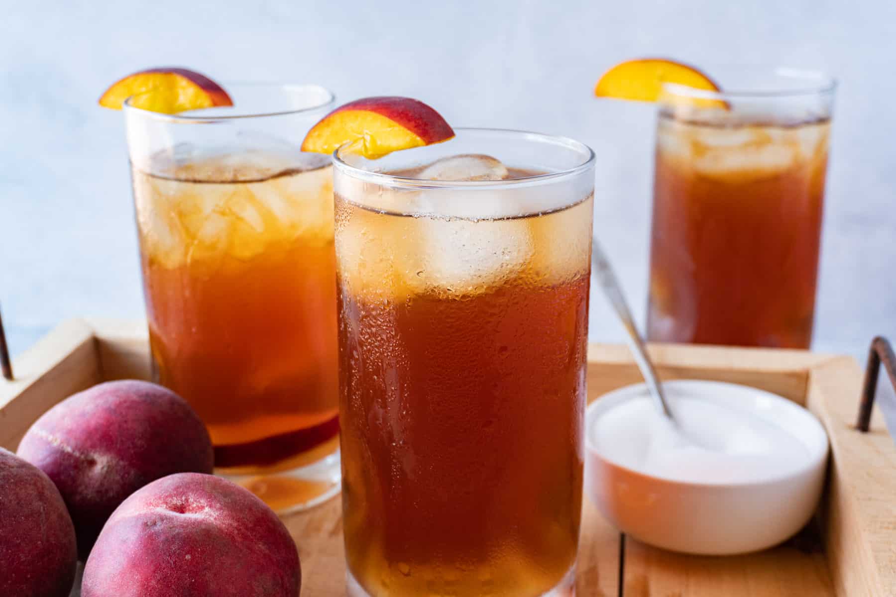 peach tea in 3 glasses