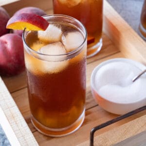 peach tea on wooden tray featured image