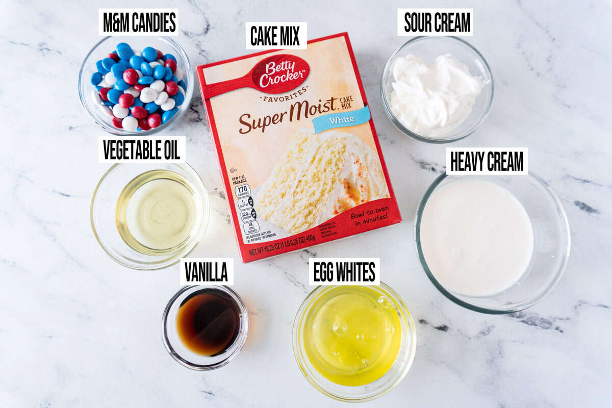 Ingredients for red, white, and blue cupcakes in individual bowls and labeled.
