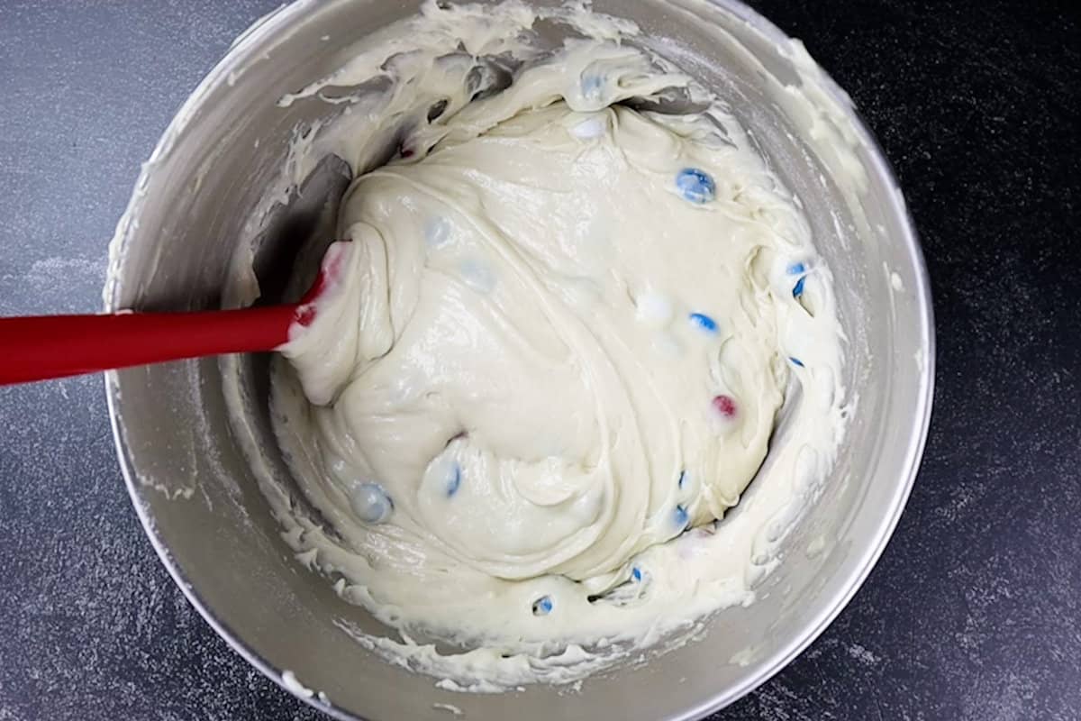 cupcake batter with M&Ms mixed in