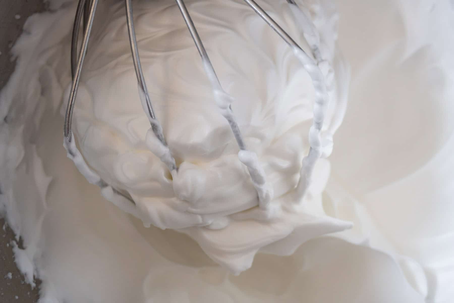 Egg whites whisked to hard peaks via a stand mixer whisk.