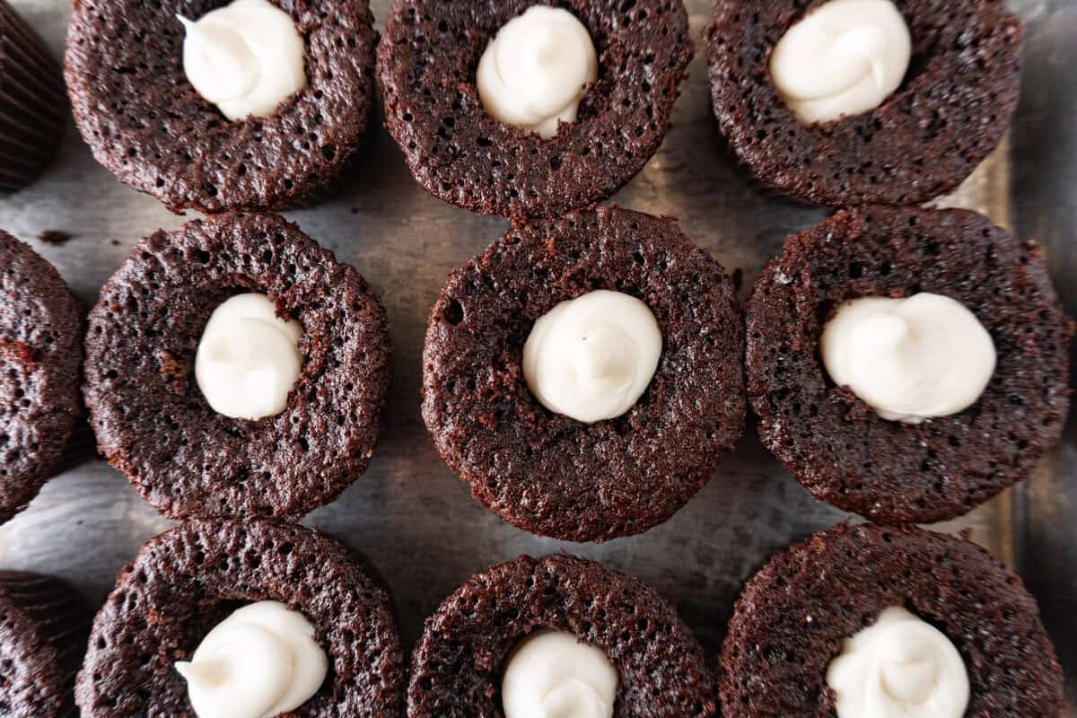 cupcakes with filling piped into centers.