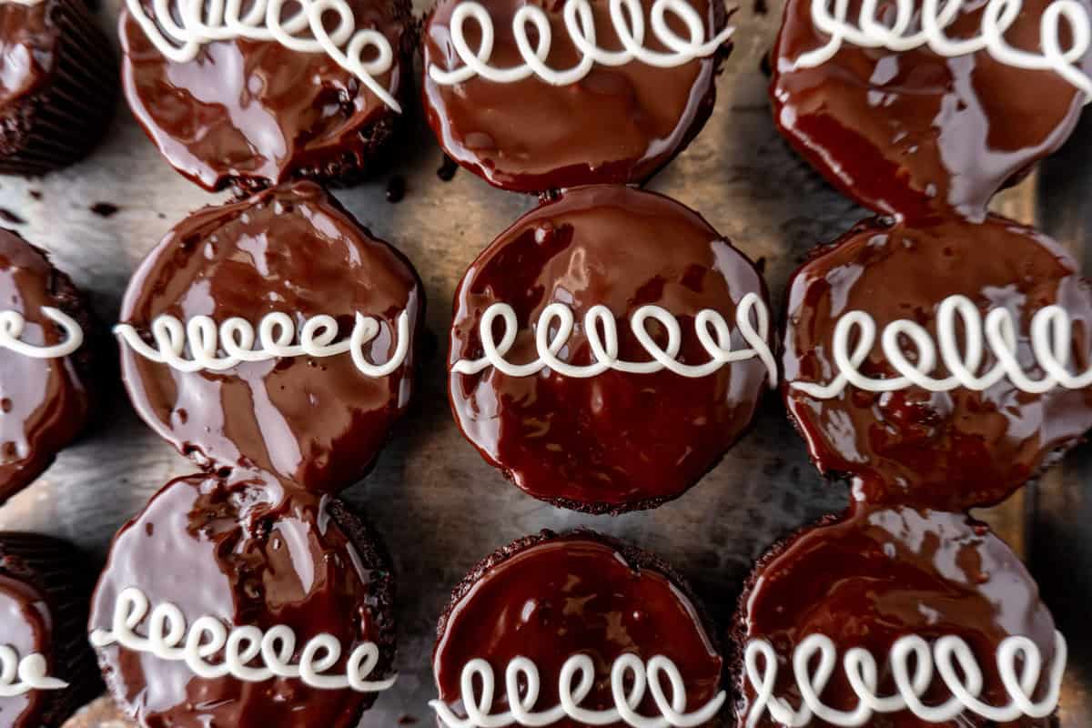 cupcakes with white loop line piped on top.