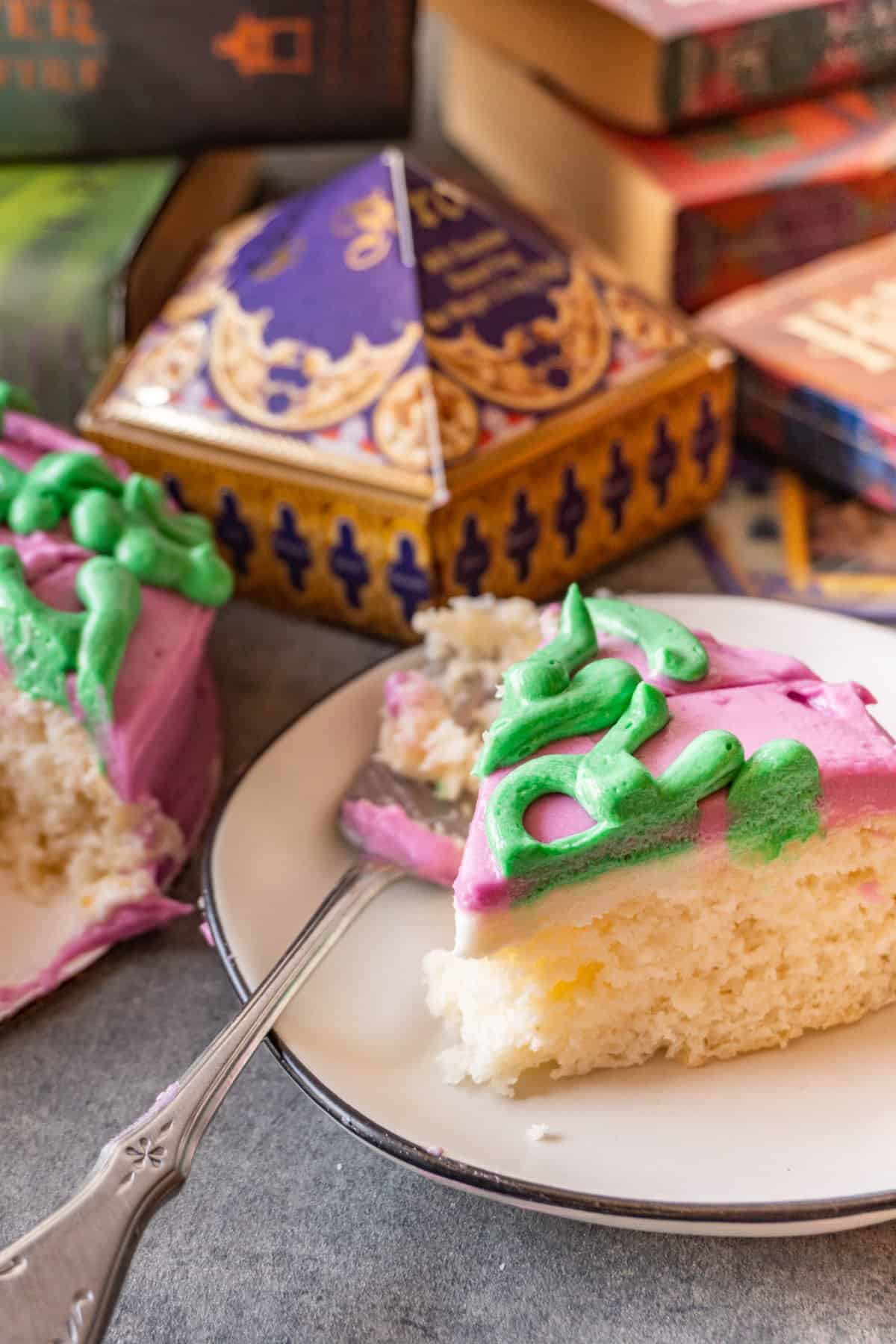 harry potter birthday cake slice next to cut cake