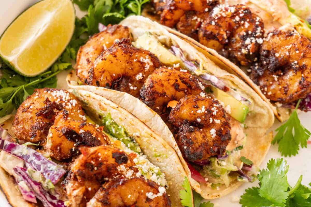 3 spicy shrimp tacos on plate