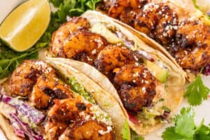 3 spicy shrimp tacos on plate