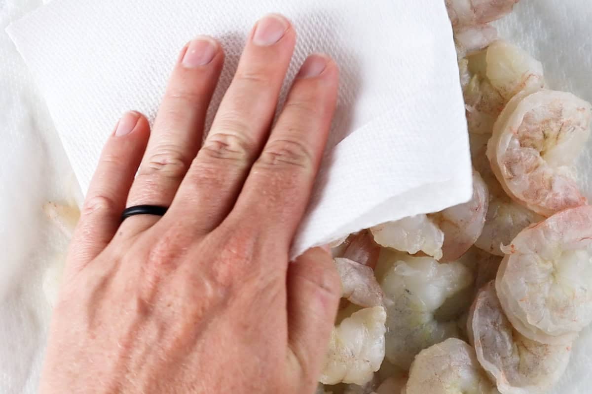 patting shrimp dry