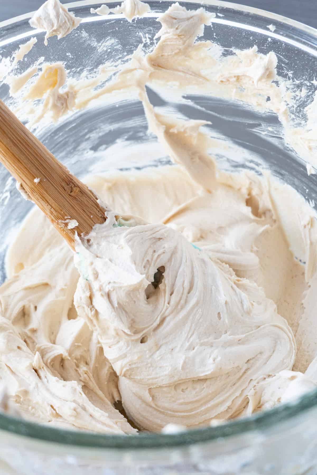 brown sugar frosting in bowl with spatula