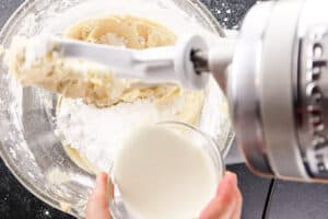 adding heavy cream to bowl