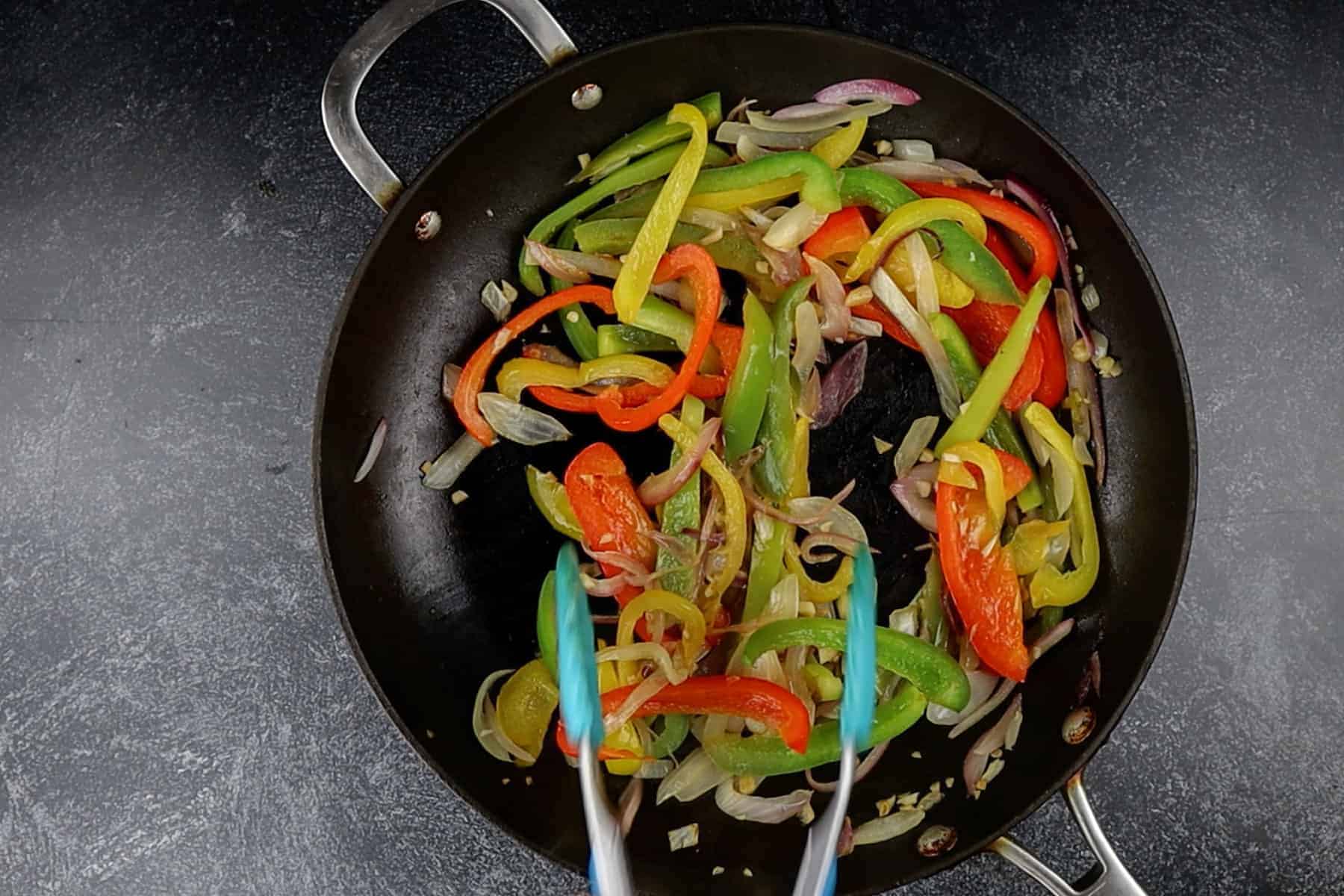 sautéed veggies in fry pan.