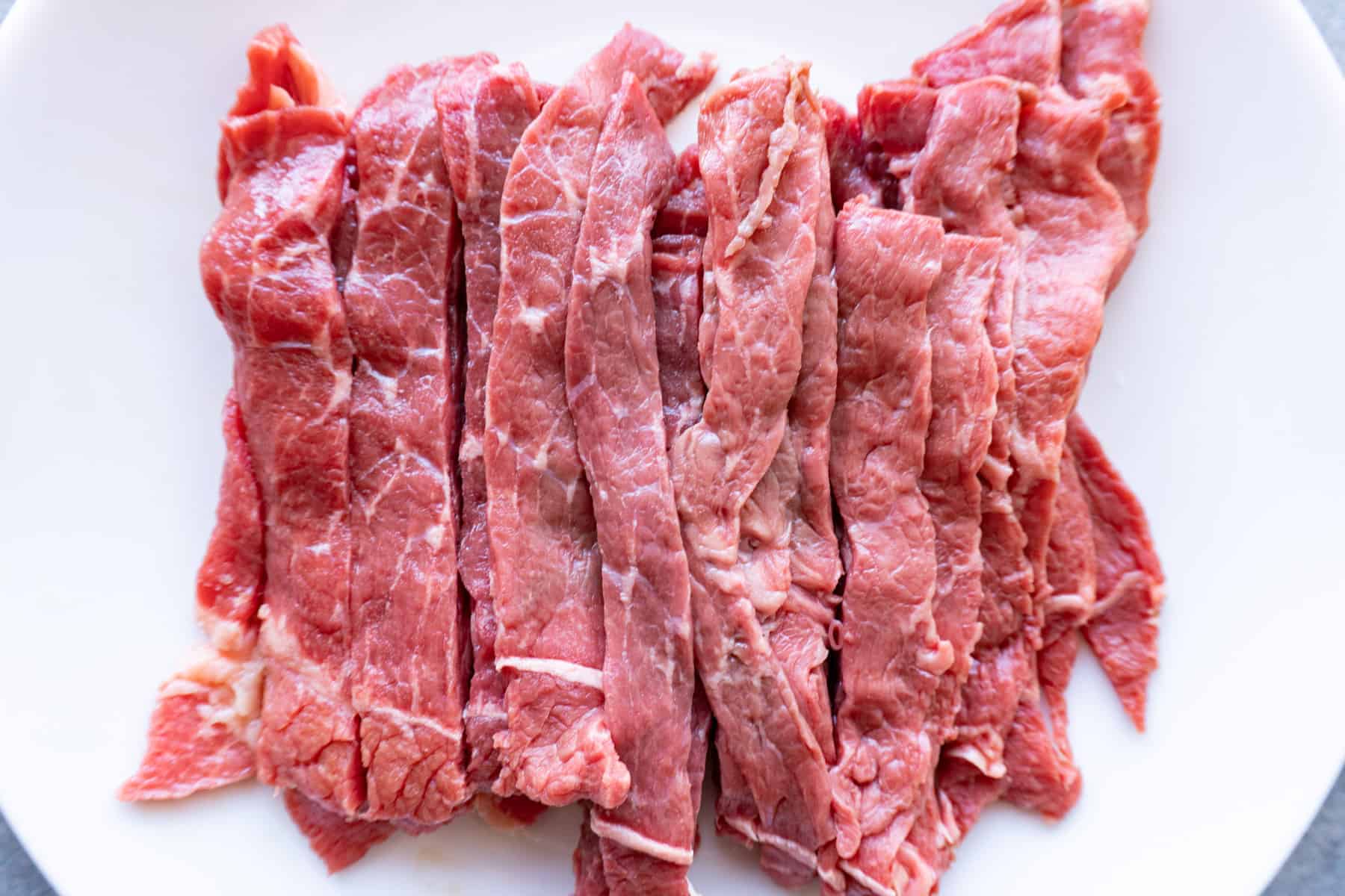 fajita steak sliced into strips.