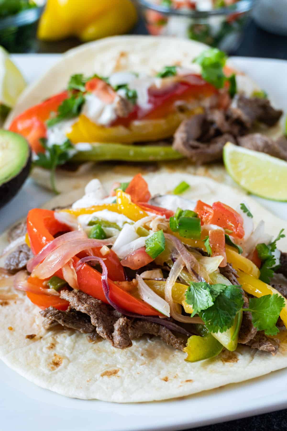 Easy beef fajita tacos- flavorful, easy to make, and perfect for dinner! fajita filling on a tortilla