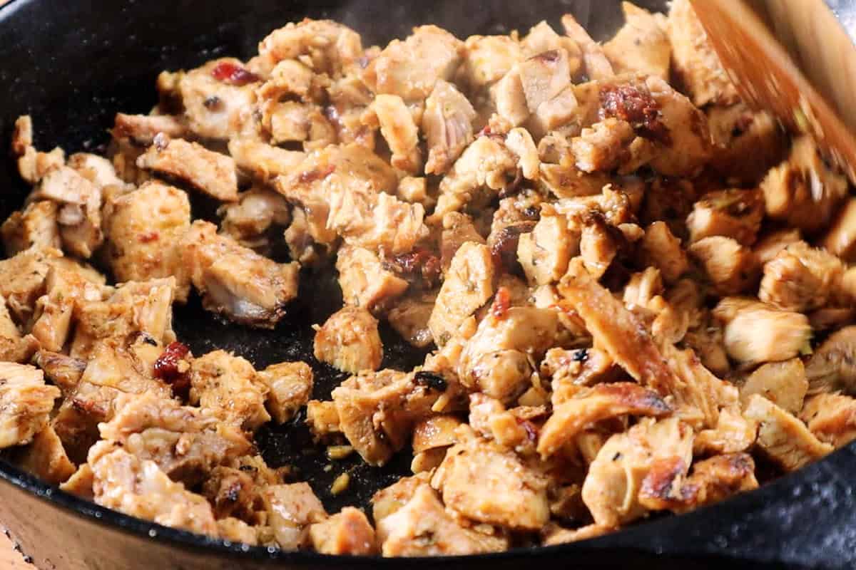 tossing chicken in reserved marinade and heating in a cast iron skillet.