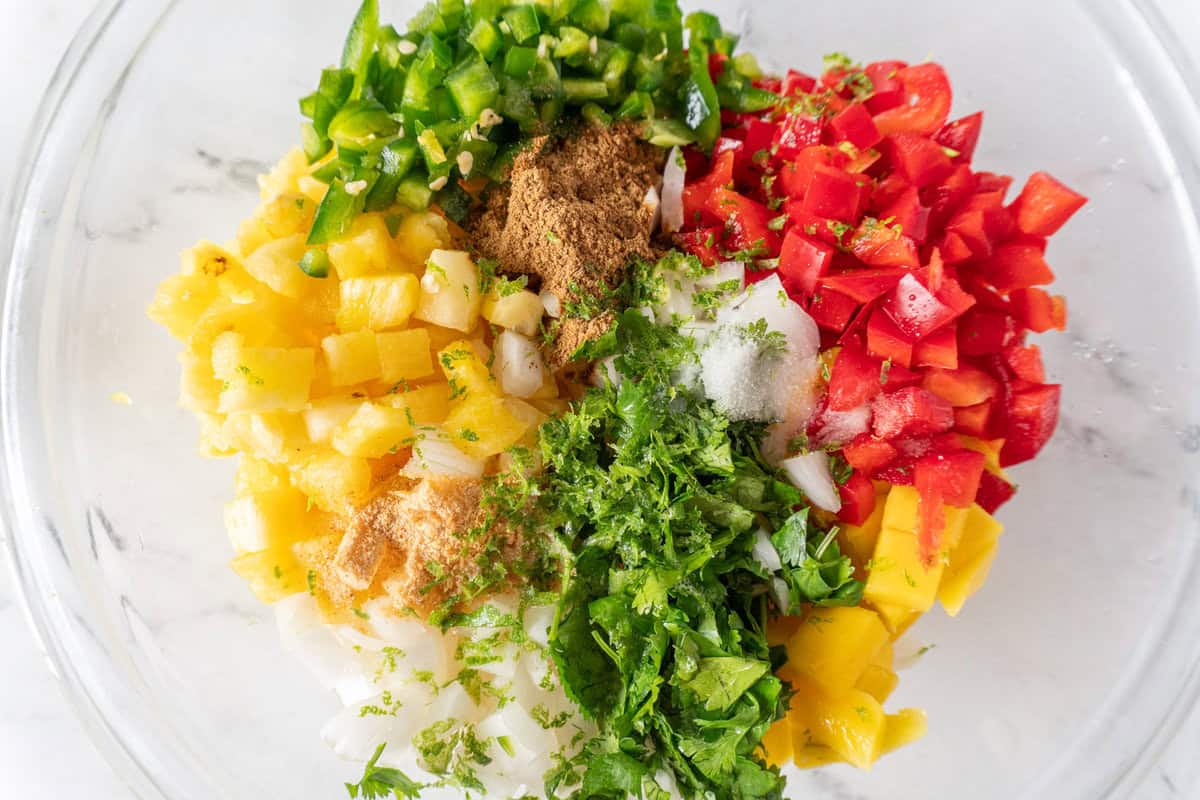 pineapple mango salsa ingredients in bowl