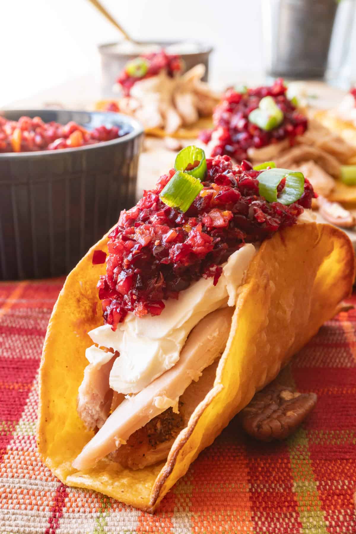 Taco with turkey, cream cheese, cranberry relish and green onion