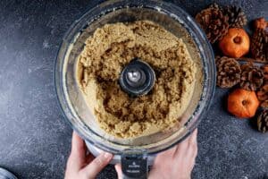 Grahmacrakers, sugar , and butter in food processor