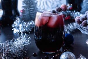 Easy Christmas Drink with sugared cranberries skewer