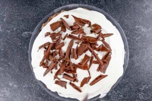 Pie with whipped cream and chocolate curls on top