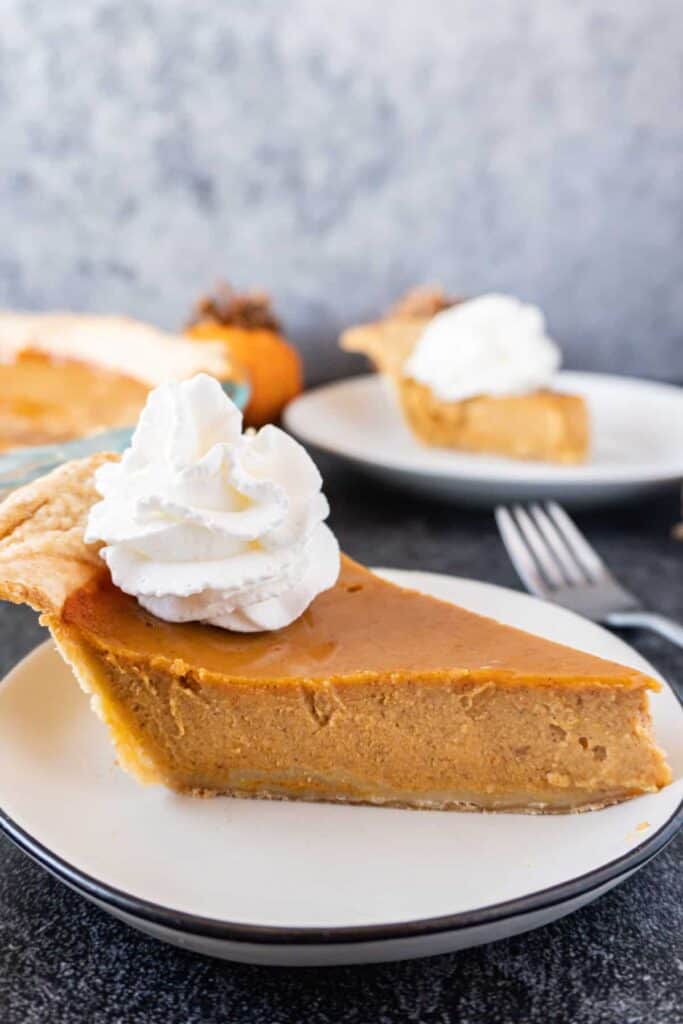 Pumpkin pie slice on plate