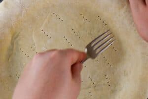 piercing pie crust with fork