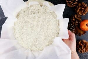 adding rice over parchmentpaper in the pie crust to prebake