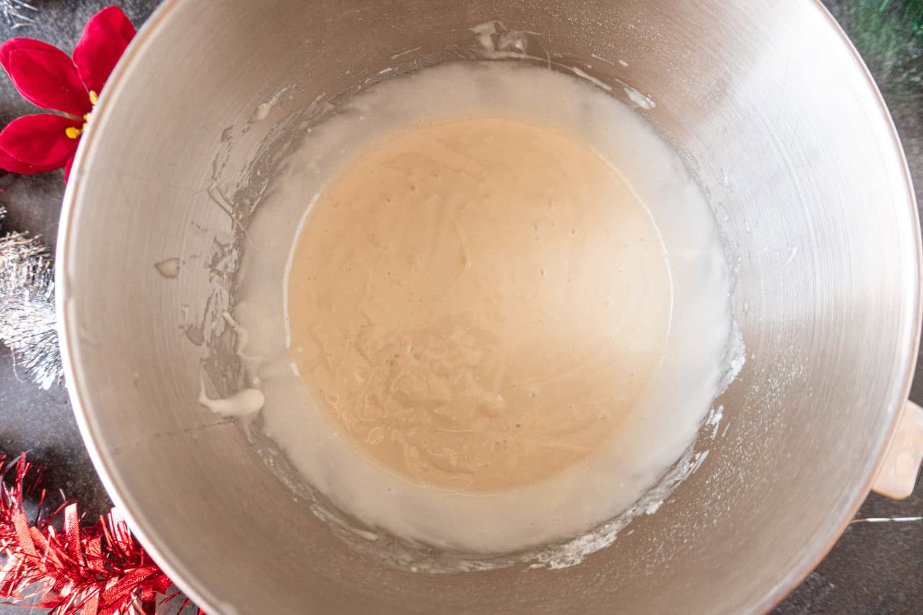 Holiday cake batter mixed in metal bowl.