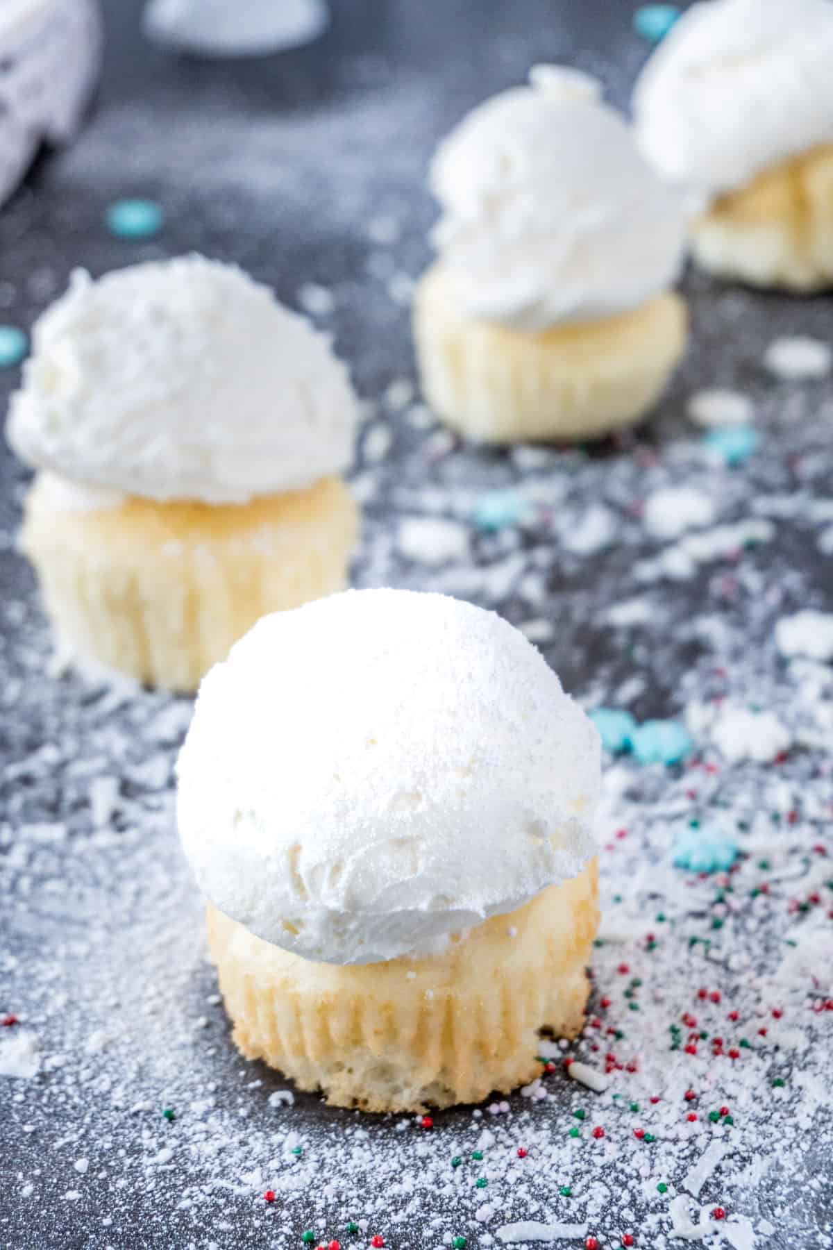 snowball cupcake with powdered sugar sprinkled on top