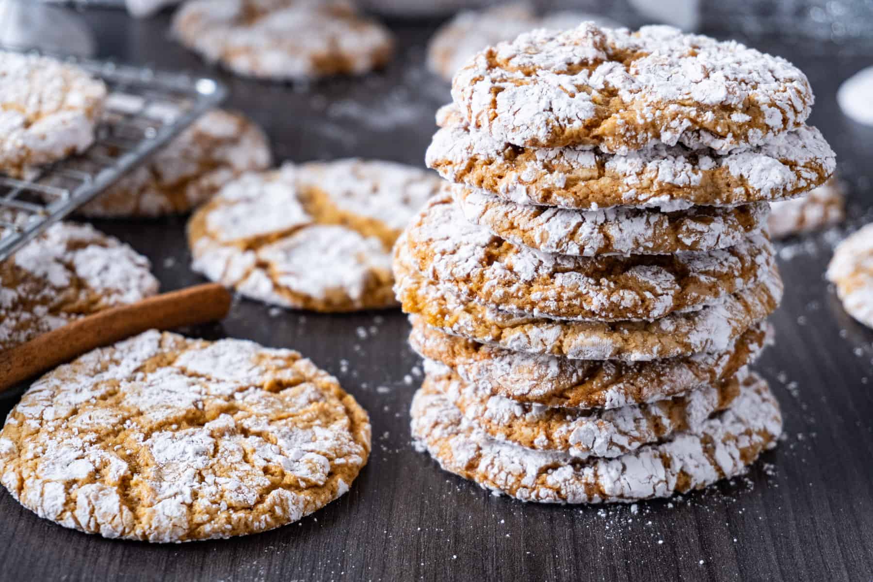 Chewy Gingerbread Cookie stacked with cookies surrounding them 